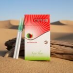 บุหรี่ Oris Watermelon แบบมวน Super Slims วางบนท่อนไม้กลางทะเลทราย