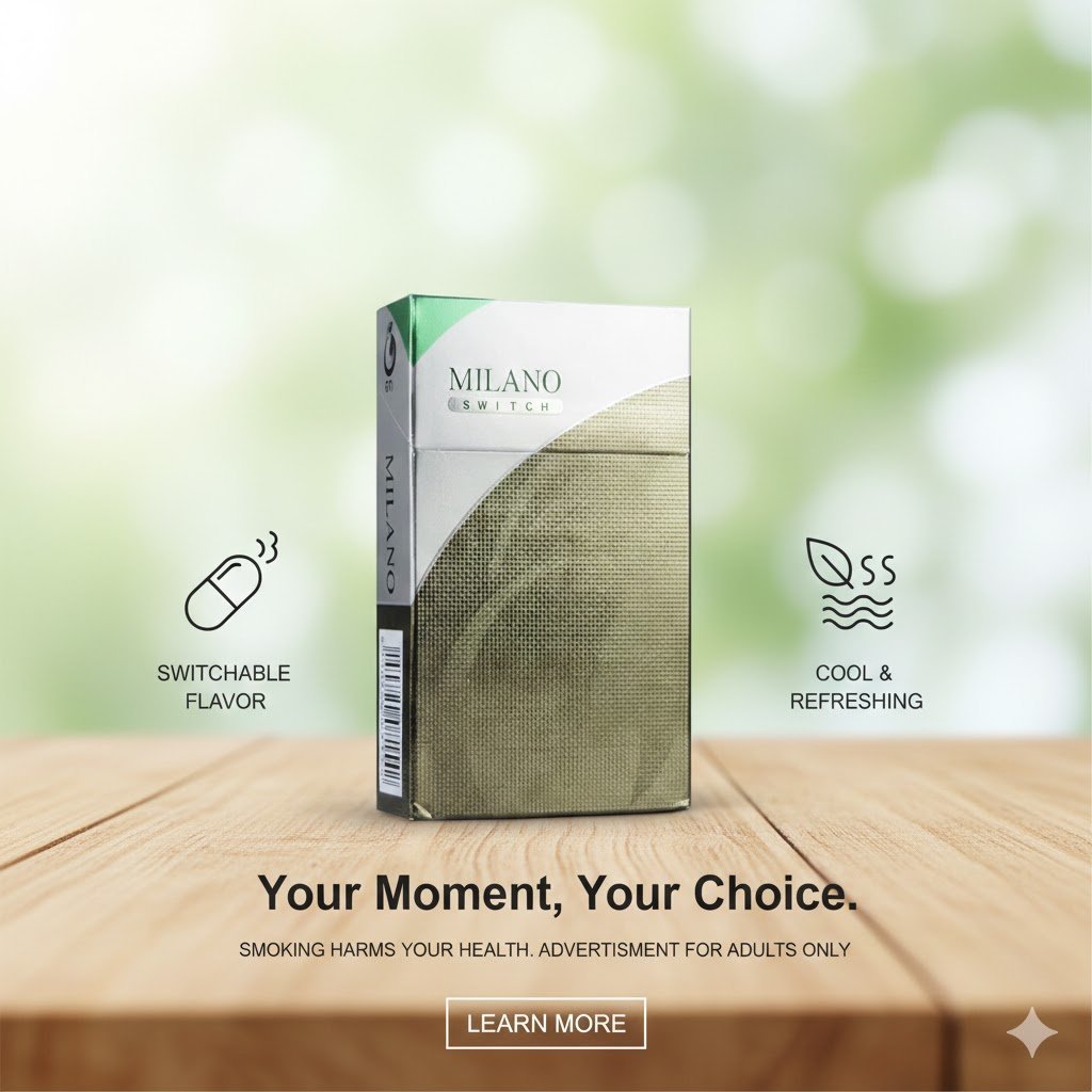 ซองบุหรี่ Milano Switch สีเงินและเขียวเมทัลลิก วางบนพื้นโต๊ะไม้ ท่ามกลางบรรยากาศธรรมชาติที่สว่างสดใส พร้อมไอคอน Switchable Flavor